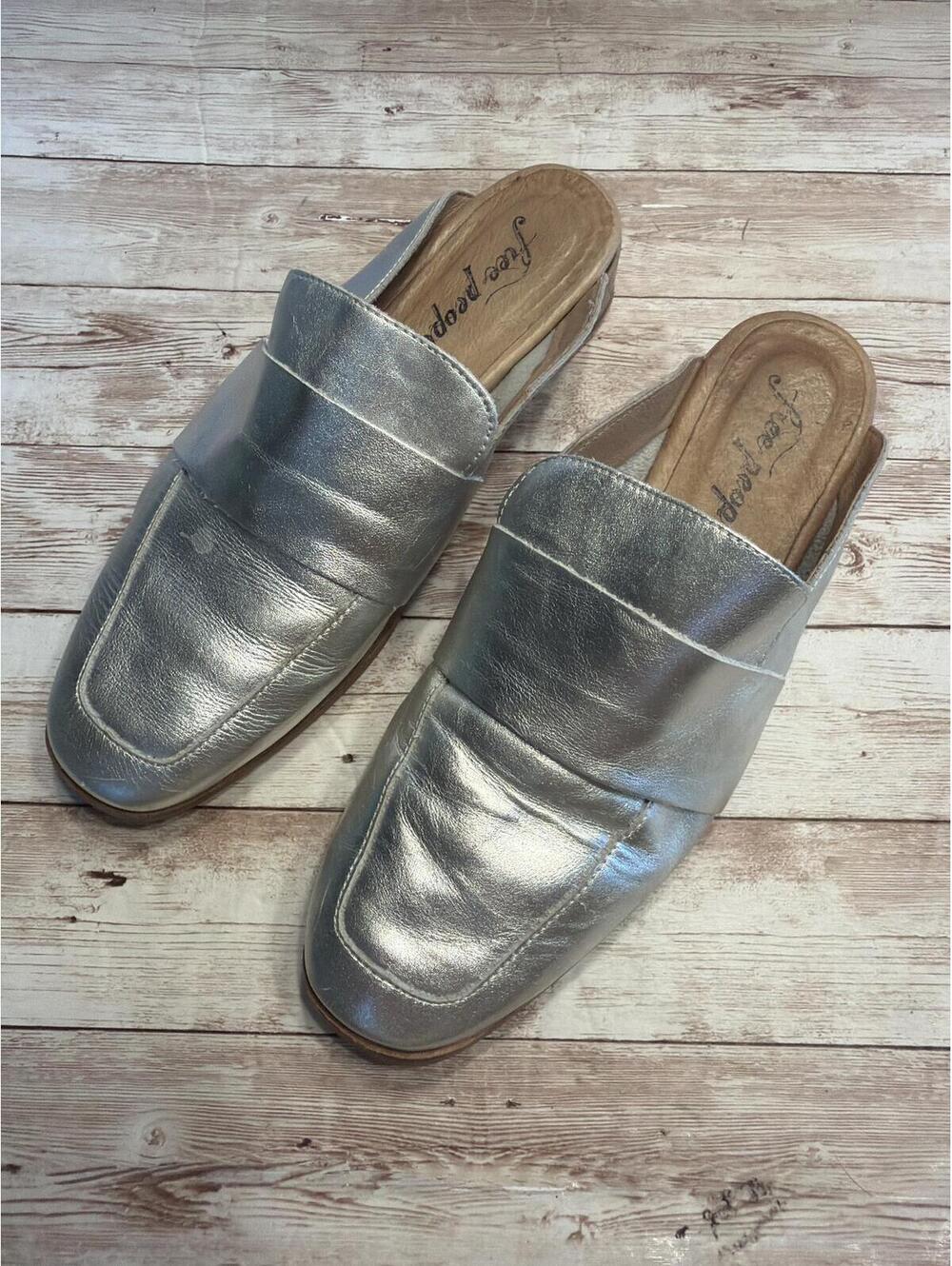 Free People 'At Ease' metallic silver mules featuring slip-on design square toe